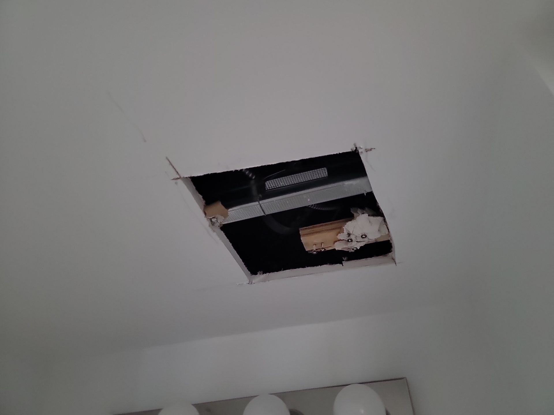 Ceiling access hole cut open for water damage inspection — drywall repair GTA