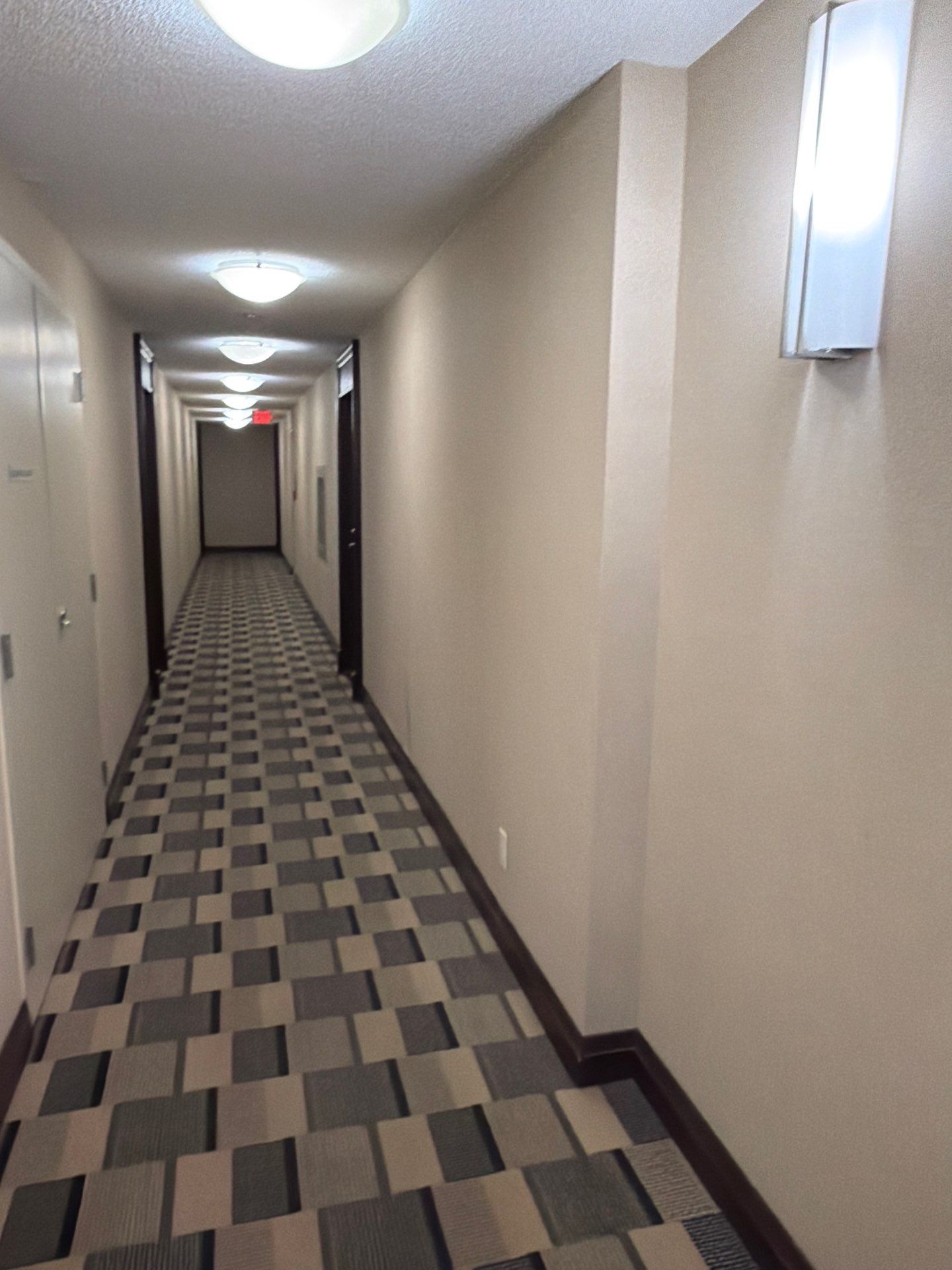 Fully restored condo corridor after rebuild — property management repair GTA