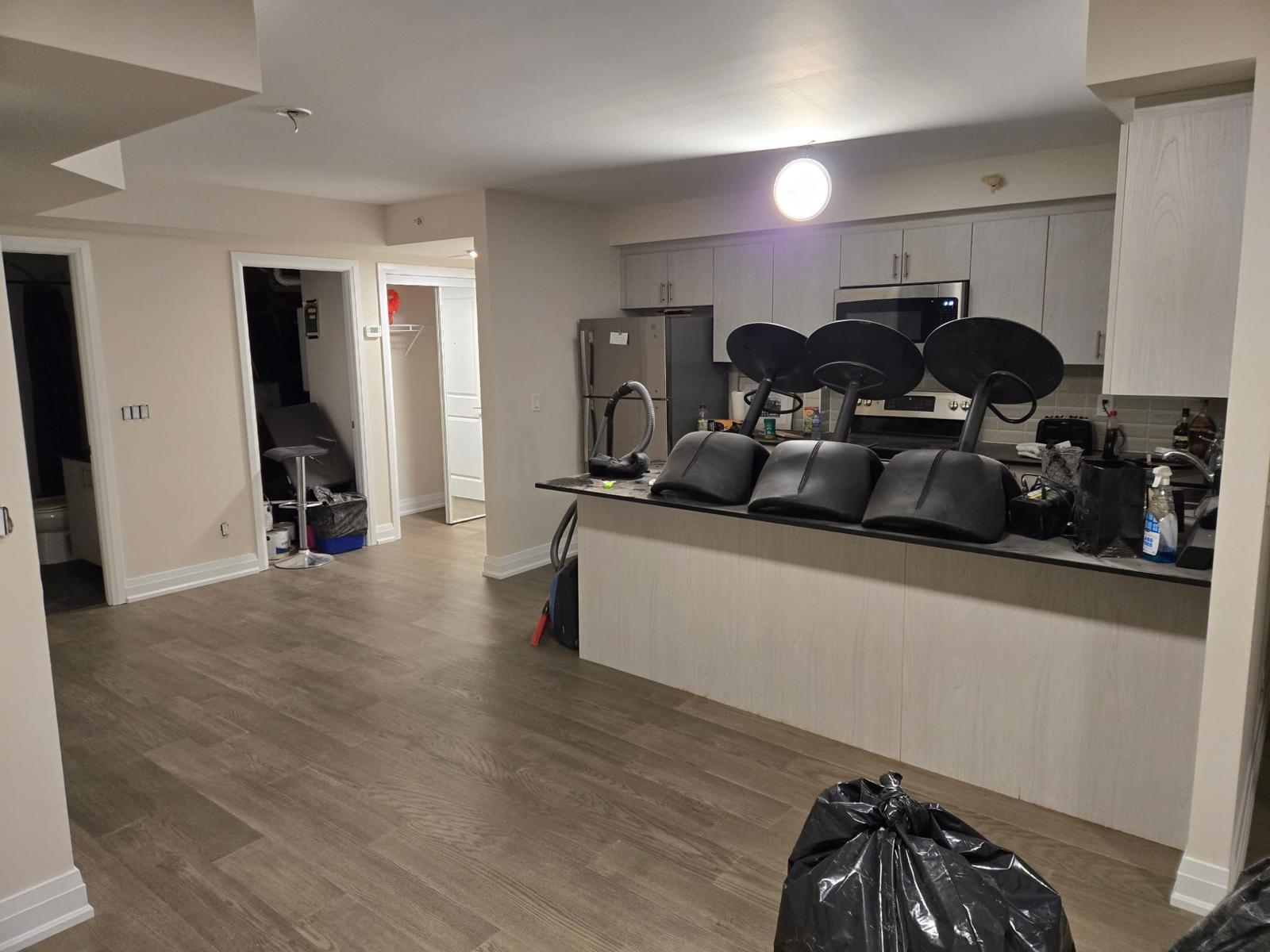 Completed condo unit repair with flooring and kitchen — property management repair GTA